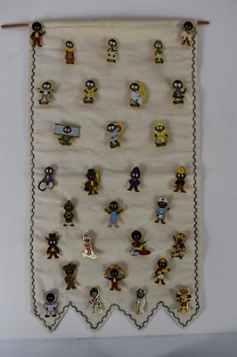 Lot 309 - A group of vintage Robertsons Golly badges.