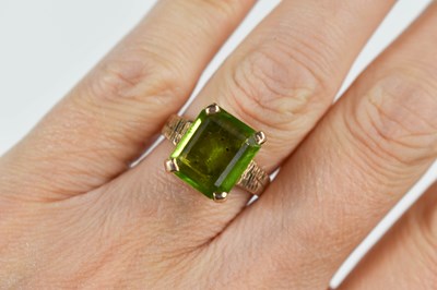 Lot 73 - A 9ct gold and peridot dress ring, the large...