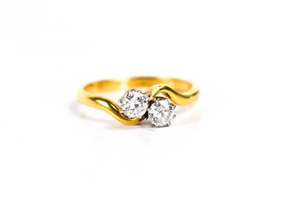 Lot 272 - An 18ct gold and diamond crossover ring, each...