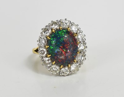 Lot 36 - An 18ct hallmarked opal and diamond cluster...