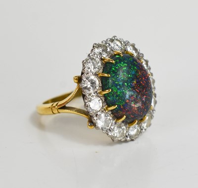 Lot 36 - An 18ct hallmarked opal and diamond cluster...