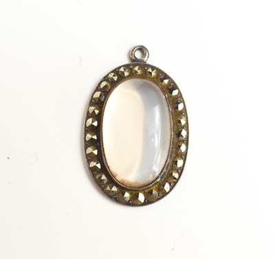 Lot 44 - A silver, marcasite and moonstone pendant, the...