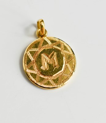 Lot 225 - A gold pendant in the form, of decorative...