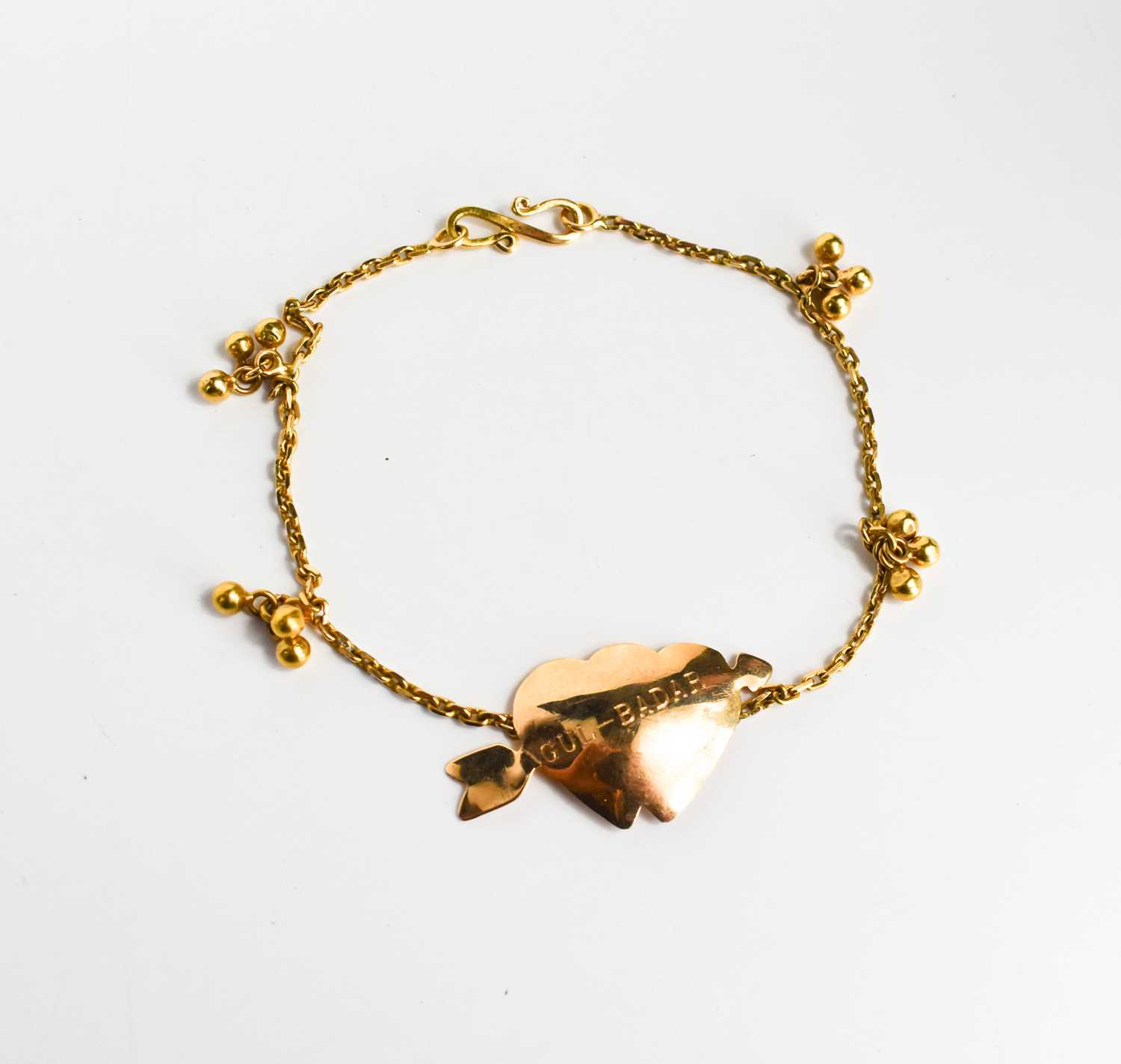 Lot 216 - A gold bracelet set with a double love heart,...