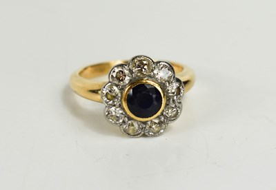 Lot 55 - A gold, diamond and sapphire flowerhead ring,...
