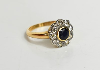 Lot 55 - A gold, diamond and sapphire flowerhead ring,...