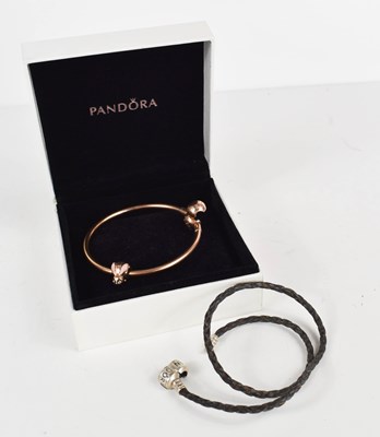 Lot 299 - A Pandora bangle, rose gold coloured with...