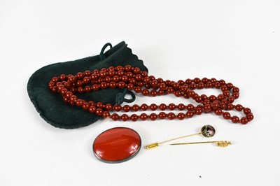 Lot 283 - A string of vintage beads, likely carnelian,...