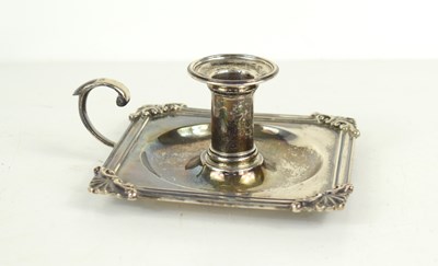 Lot 385 - A George III silver chamberstick, the base of...