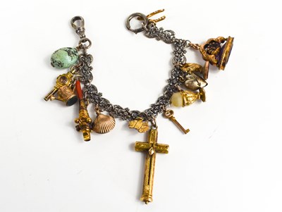 Lot 335 - A 19th century charm bracelet, with gilt metal...