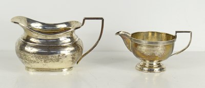 Lot 423 - A silver sauce boat together with a silver...