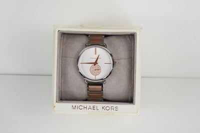 Lot 351 - A Michael Kors ladies gem set wristwatch,...