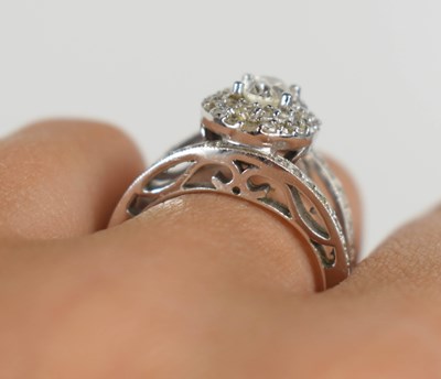 Lot 18 - A 14ct white gold and diamond dress ring, the...