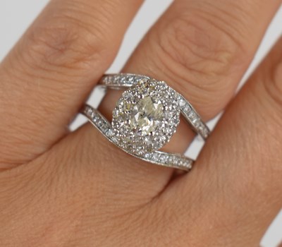 Lot 18 - A 14ct white gold and diamond dress ring, the...