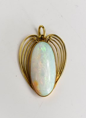 Lot 180 - An Art Nouveau style gold and opal pendant,...