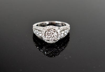Lot 21 - A 14ct white gold and diamond cluster ring,...