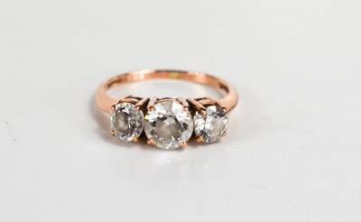 Lot 77 - A 14ct rose gold and cubic zirconia three...