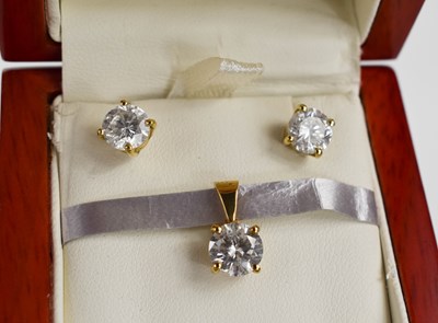 Lot 30 - A pair of diamond earrings and matching...