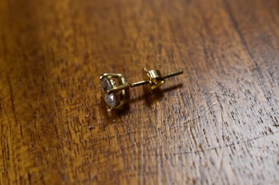 Lot 30 - A pair of diamond earrings and matching...