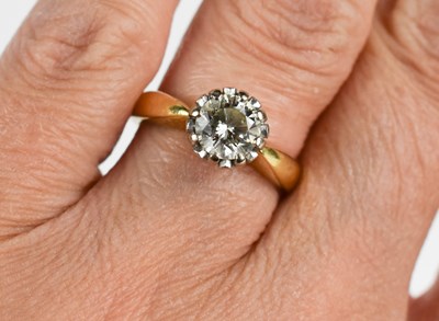 Lot 31 - An 18ct gold and solitaire diamond ring, the...