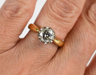 Lot 31 - An 18ct gold and solitaire diamond ring, the...