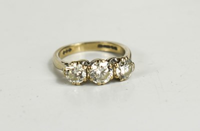 Lot 280 - An 18ct white gold and diamond three stone...