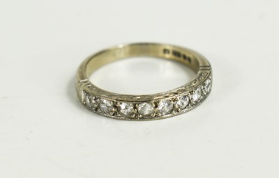 Lot 249 - An 18ct white gold and diamond half eternity...