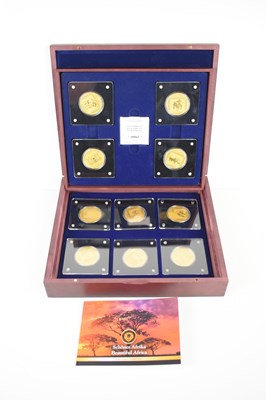 Lot 52 - A 24ct gold eight coin set of African wildlife,...