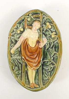 Lot 412 - A Majolica green glazed dish, depicting a man...