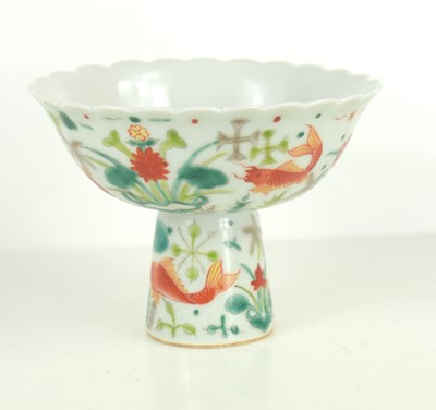 Lot 21 - A Chinese porcelain stem cup, the body...