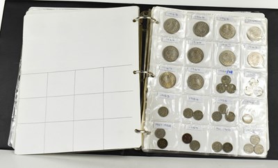 Lot 94 - An album of coins to include crowns, six pence,...