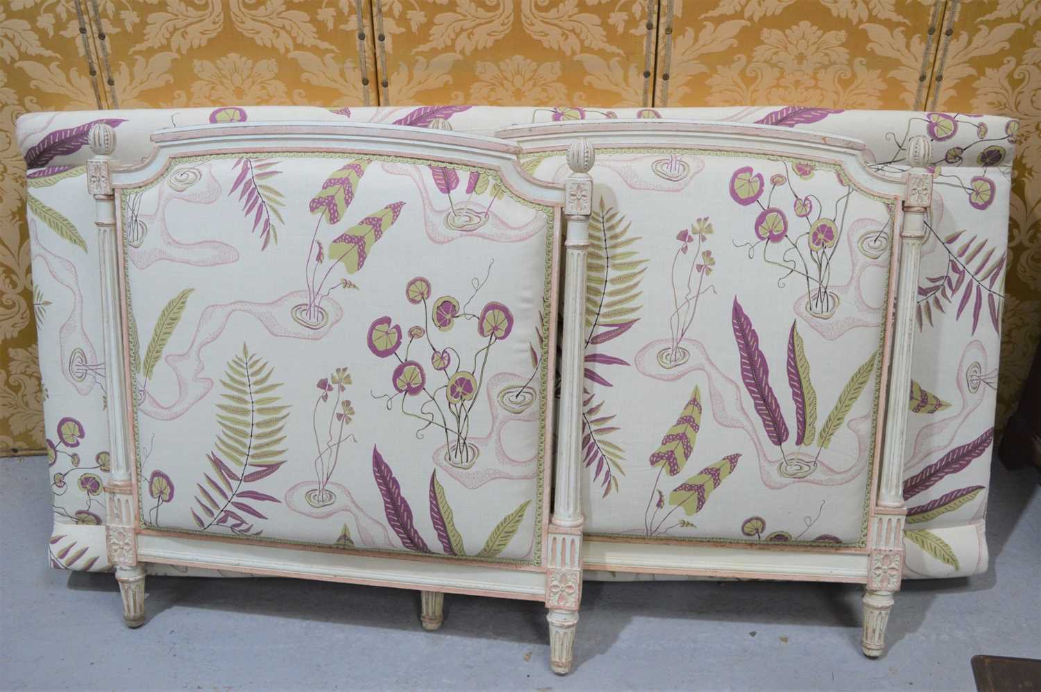 Lot 634 - A French style day bed, painted cream and...