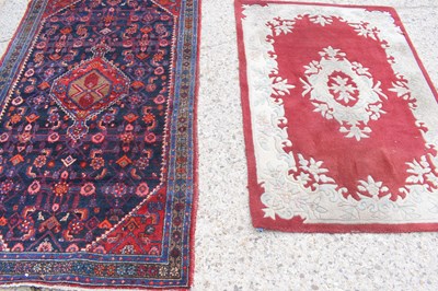 Lot 520 - A Middle Eastern wool rug, red ground with...