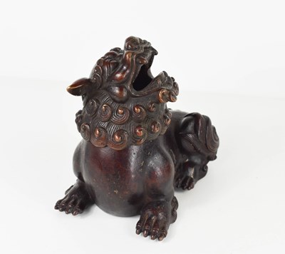 Lot 111 - An early bronze dog of fo, with red patination,...