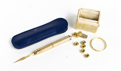 Lot 87 - A 9ct gold propelling toothpick, engine turned...