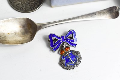 Lot 78 - A silver spoon, silver and enamel Naval badge,...