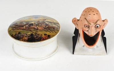 Lot 379 - A bisque porcelain ashtray and match holder by...