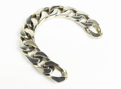 Lot 84 - A heavy silver chain box link bracelet, one...