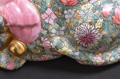 Lot 86 - A Chinese Famille Rose modelled sleeping cat,...