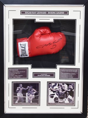 Lot 313 - A boxing glove signed by Sugar Ray Leonard in...