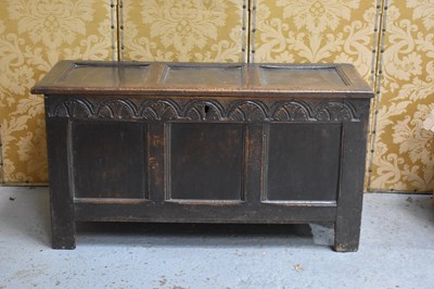 Lot 527 - A 17th century oak coffer with triple panelled...