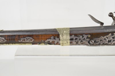 Lot 8 - A late 18th century highly decorated flintlock...