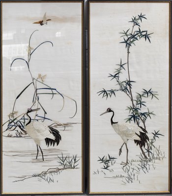 Lot 215 - A pair of Chinese embroidered panels,...