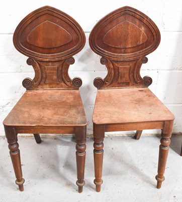 Lot 510 - A pair of Victorian mahogany hall chairs, with...