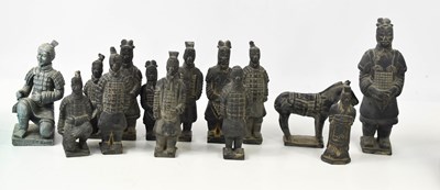 Lot 431 - A group of pottery figurines in the form of...