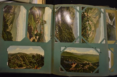 Lot 28 - An early 20th century postcard album, the vast...