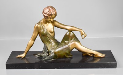Lot 188 - An Art Deco spelter figure of a woman beside...