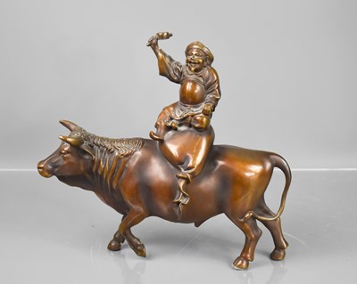 Lot 206 - A Japanese bronze man riding a water buffalo,...