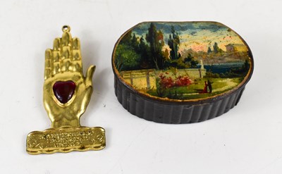 Lot 225 - A Victorian papier mache snuff box, black...