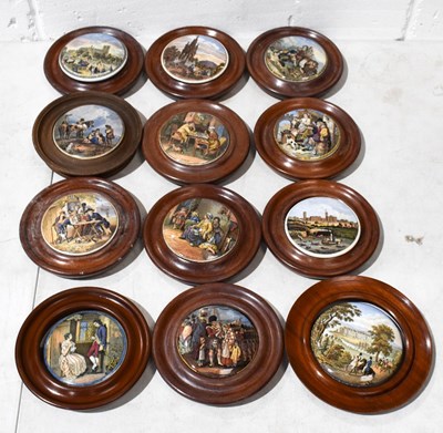 Lot 403 - A group of thirteen Prattware pot lids, in...